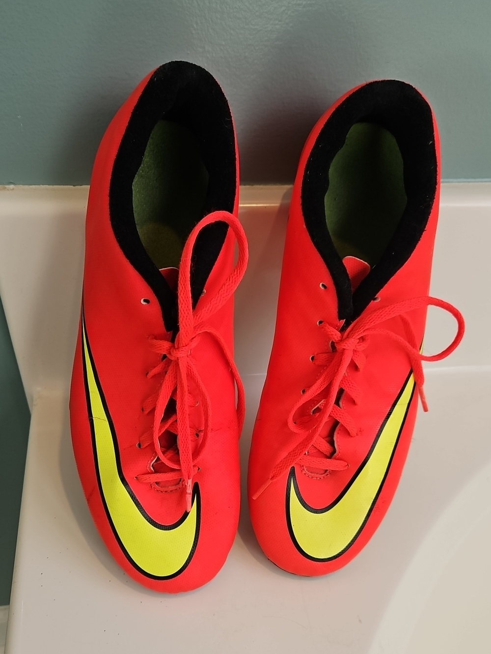 Nike Men's Neon Red Soccer Shoes with Yellow Accent